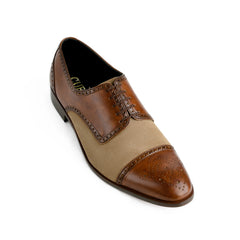Close-up detail of suede and leather texture on Noble Garnet Oxford cap-toe shoes highlighting craftsmanship