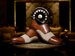 Side profile of Noble Garnet Oxford two-tone shoes highlighting sleek silhouette and premium construction