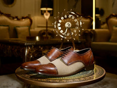 Angled view of Noble Garnet Oxford shoes in suede and leather showing cap-toe detailing