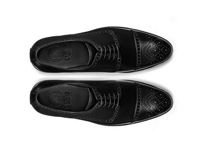 Pair of Regal Black oxford shoes top view black leather formal footwear studio shot