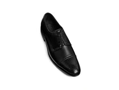 Close up detail of Regal Black oxford shoe toe and lace design premium leather craftsmanship
