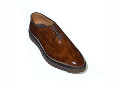 The Marcellus Cueřo Grand Atelier brown patent leather formal dress shoes studio top view showcasing glossy finish and premium craftsmanship