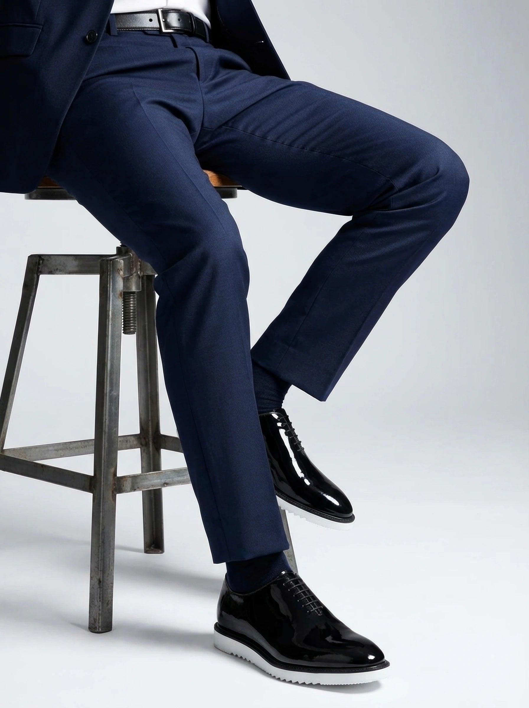 The Vance White black formal oxford shoes with white sole styled with navy suit studio fashion shoot