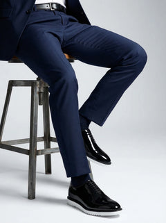 The Vance White black formal oxford shoes with white sole styled with navy suit studio fashion shoot