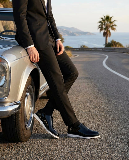 The Vance White black patent leather shoes with white sole worn beside luxury car outdoor fashion shoot