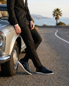 The Vance White black patent leather shoes with white sole worn beside luxury car outdoor fashion shoot