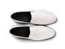 Top view of Wilfred white leather loafers showing minimal design, stitching detail, and premium handcrafted leather texture